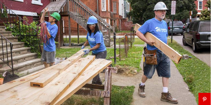 image_Habitat volunteers working with lumber