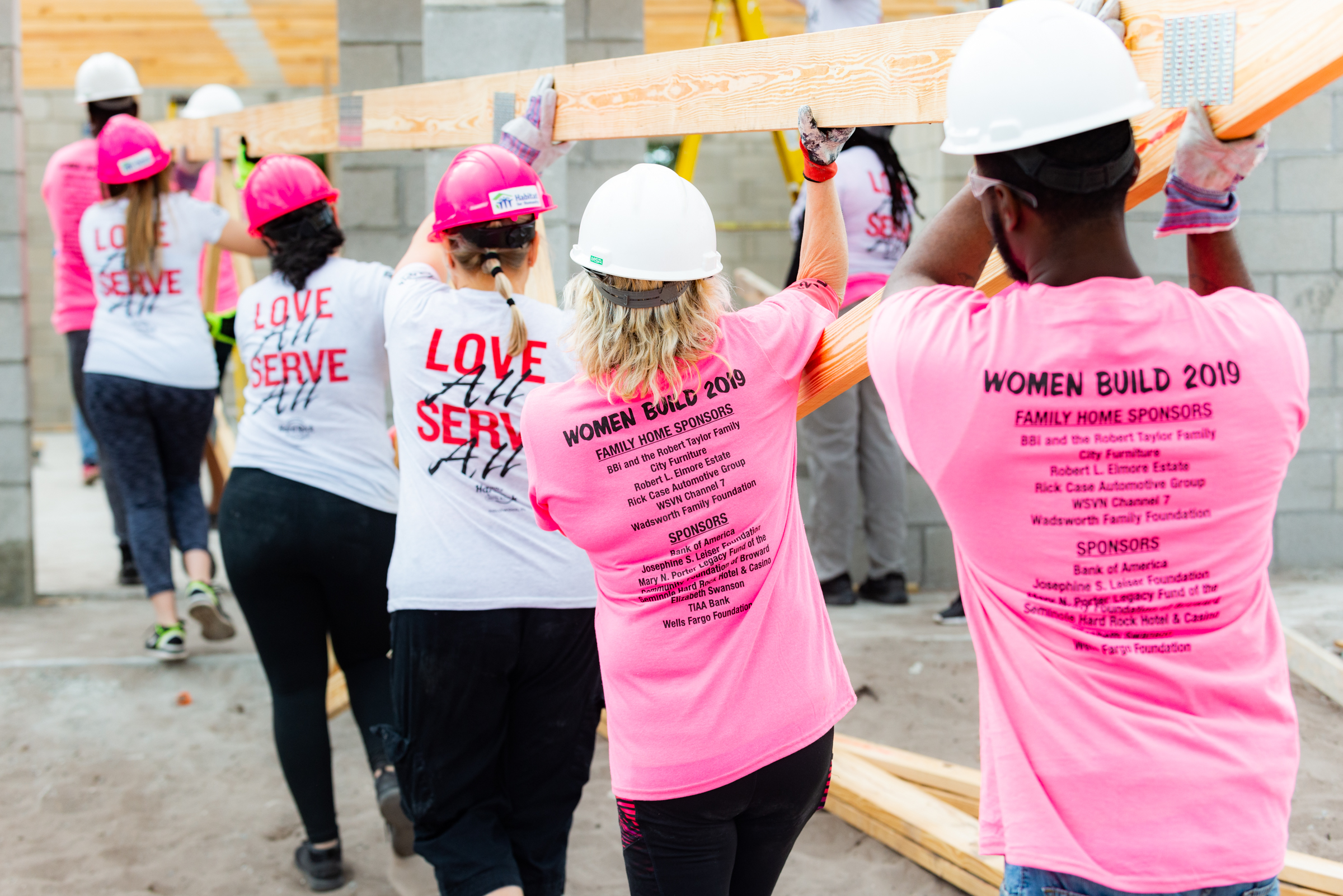 Women Build Kick-Off Pic 78 image_Women Build volunteers carrying trusses in Pompano Beach