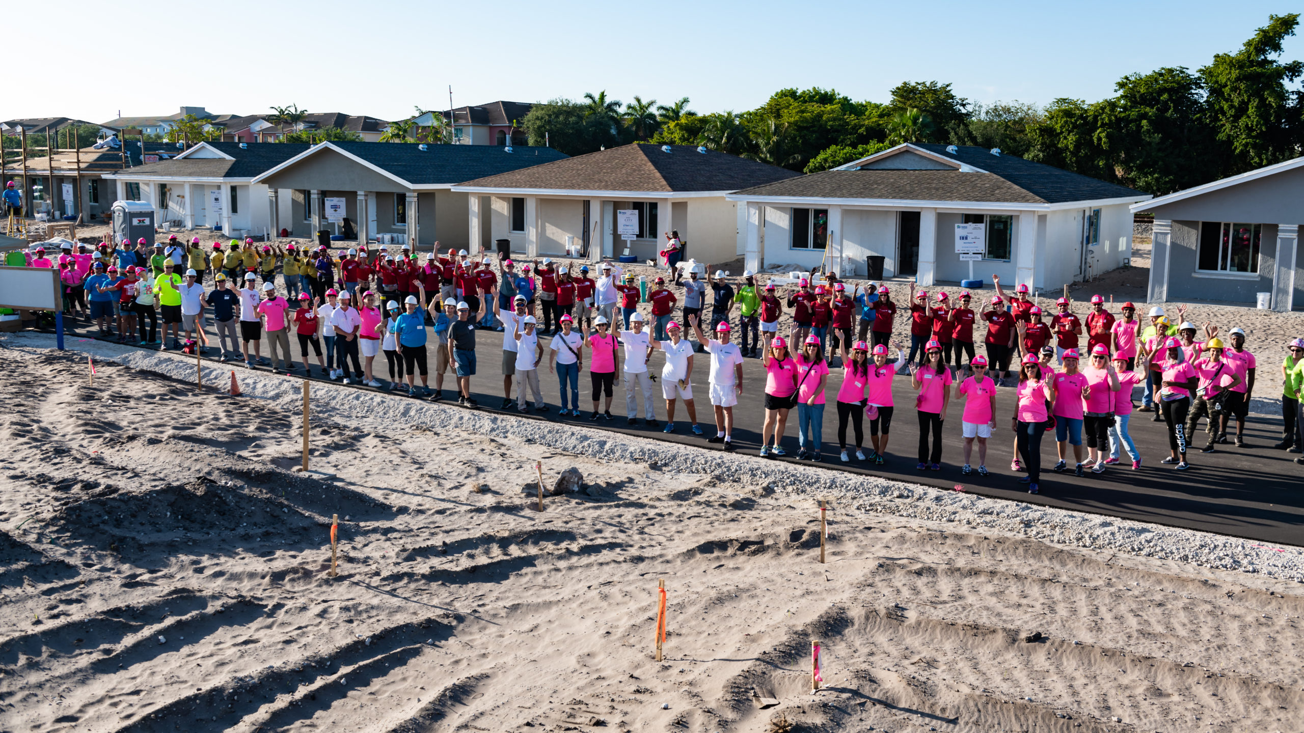 image: Habitat volunteers waving