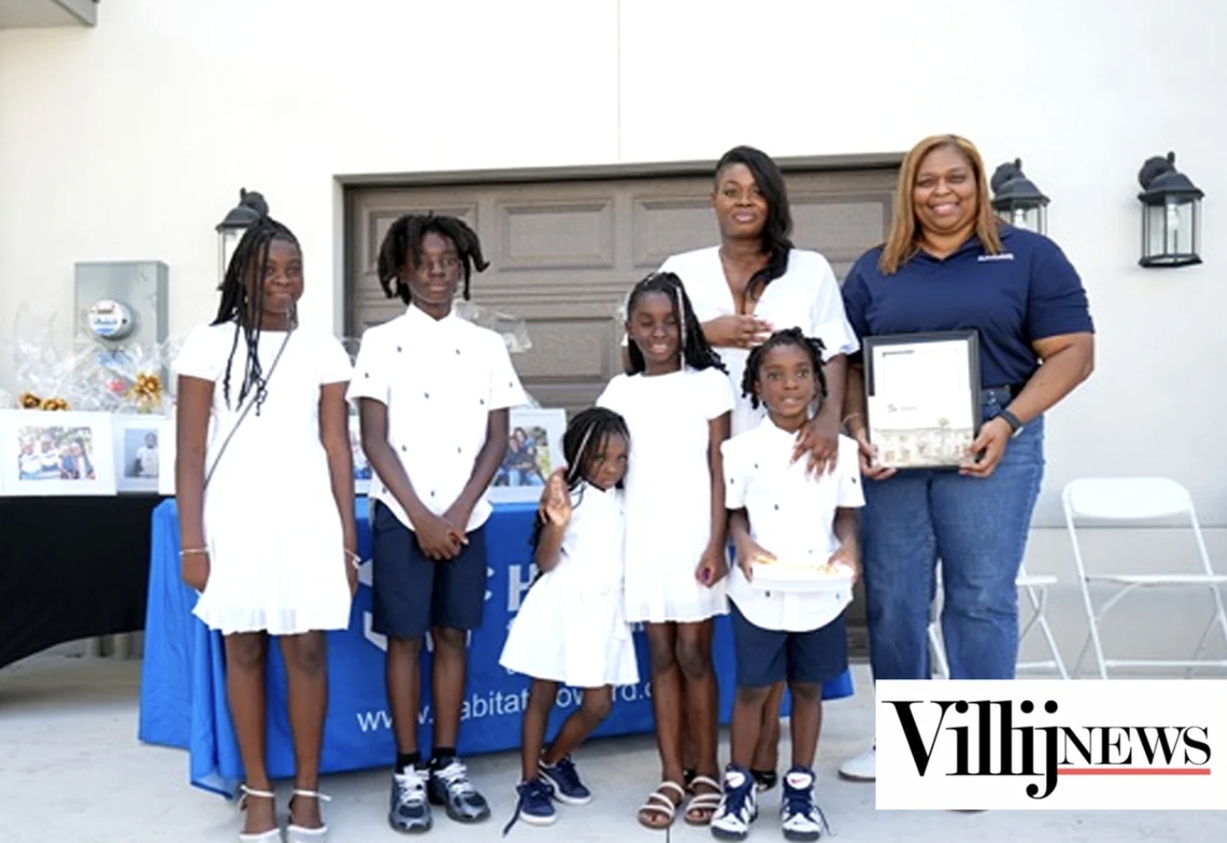June News Registered nurse and mother of five become a new homeowner, in front of their new home